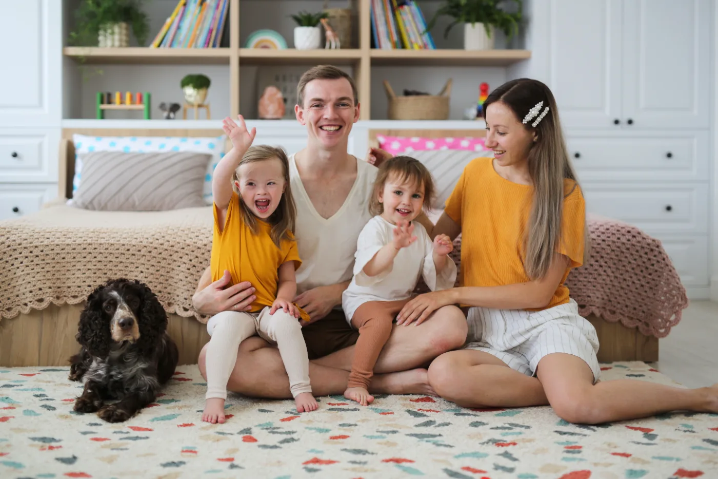 Family and housemates together at home in a shared living arrangement